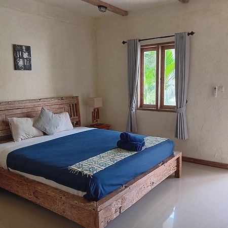 Adore Guesthouse Amed Buitenkant foto