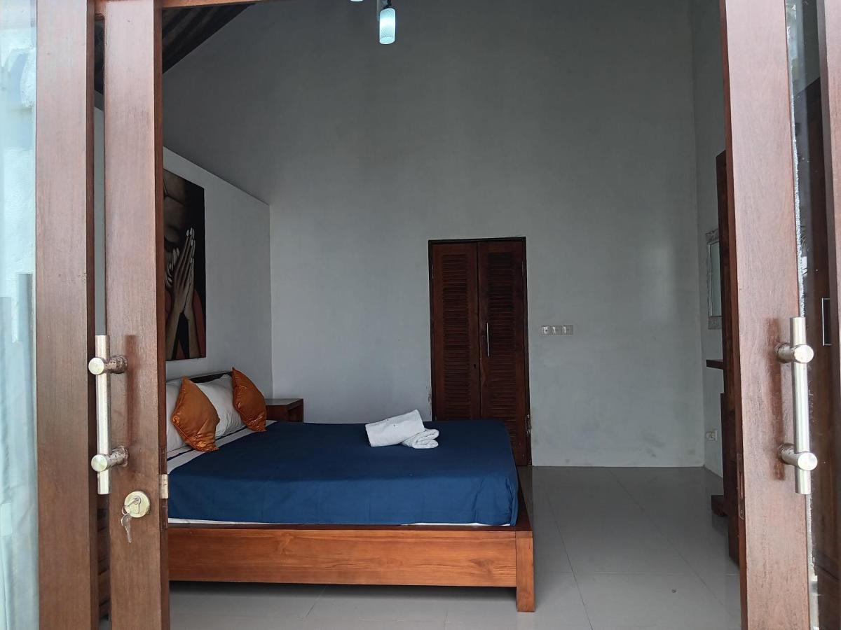 Adore Guesthouse Amed Buitenkant foto