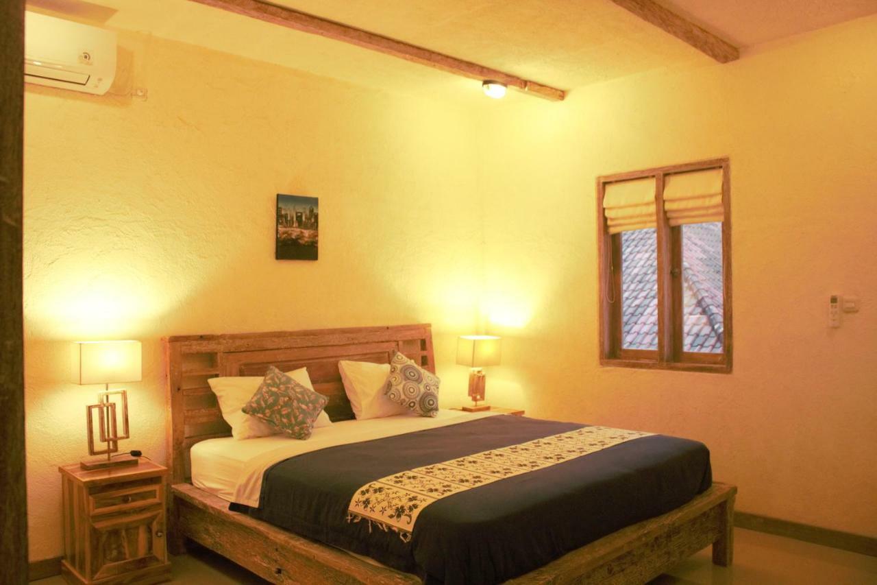 Adore Guesthouse Amed Buitenkant foto