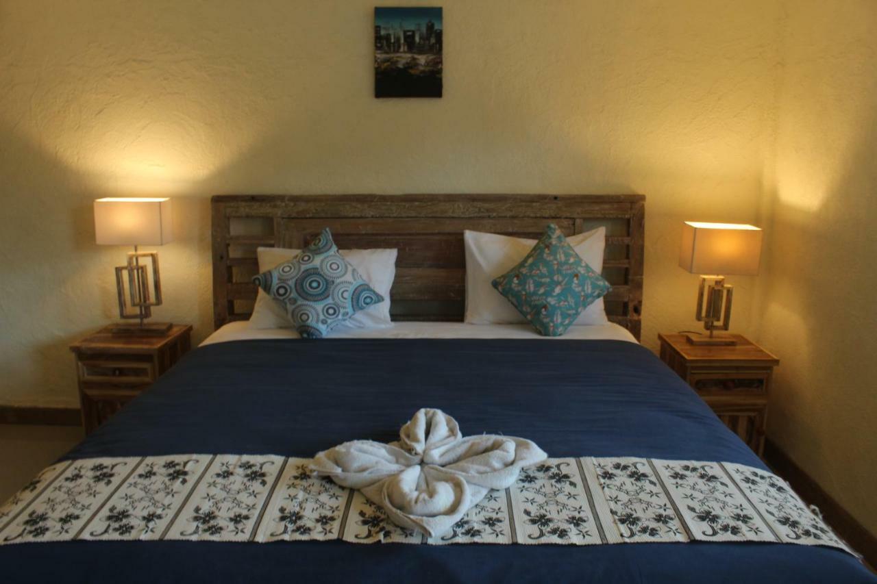 Adore Guesthouse Amed Buitenkant foto