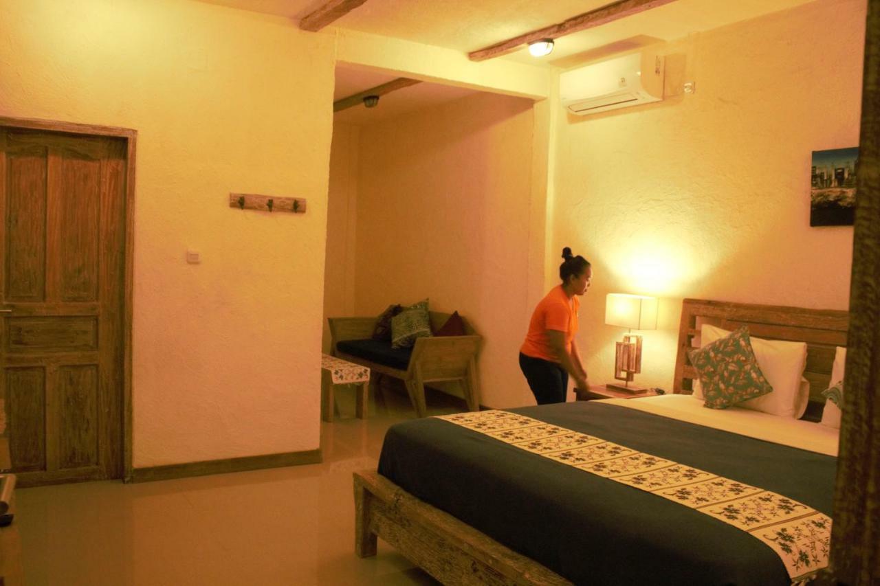 Adore Guesthouse Amed Buitenkant foto